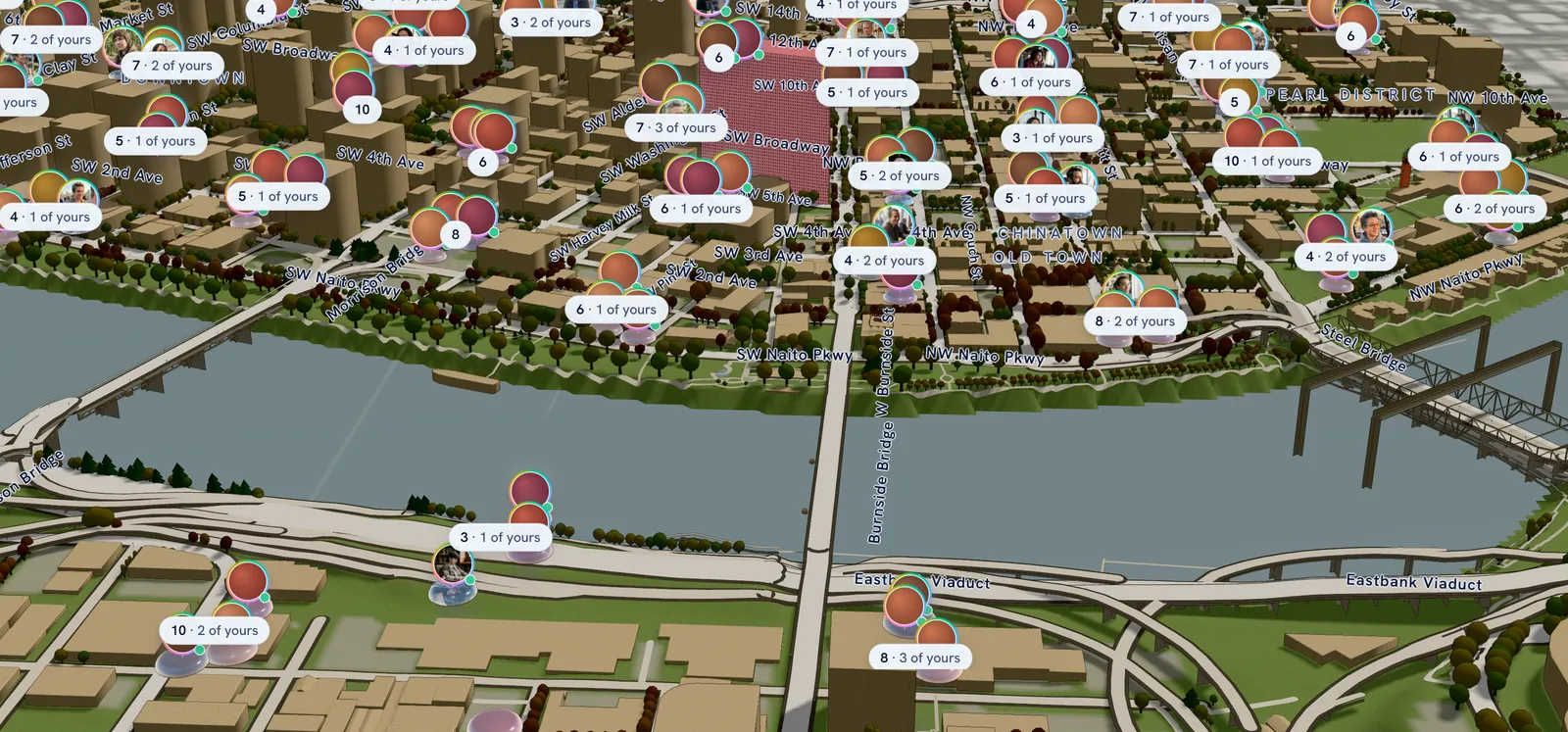The charper map of downtown Portland from above the east bank of the Willamette: the Morrison, Burnside and Steel bridges, the downtown towers, and dozens of little crowds labelled with how many people are there and how many are yours.